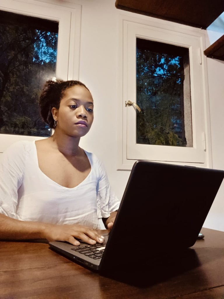 Young latina expresing her satisfaction with becoming an affiliate marketer at TecProds - Tech Solutions for financial, Professional Growth!